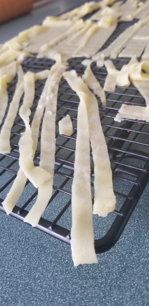 keto egg noodles drying on a cooling rack