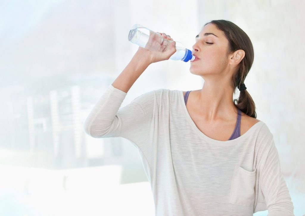 woman staying hydrated